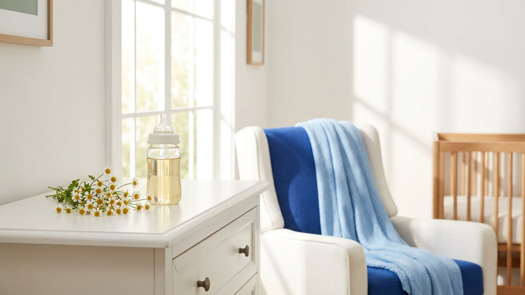 Bright nursery with a baby bottle and fresh chamomile flowers on a dresser