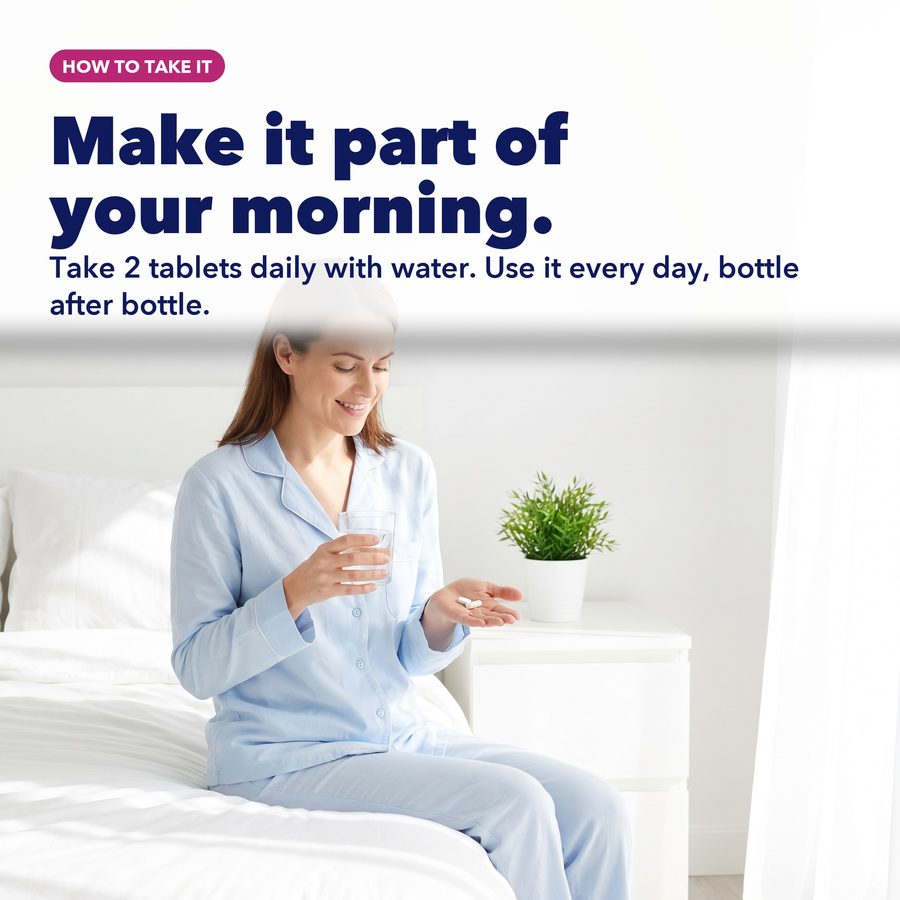 Woman taking Ovulat with water as part of her morning routine
