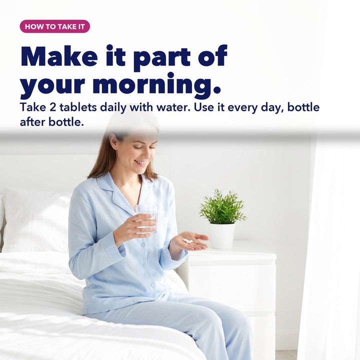 Woman taking Ovulat with water as part of her morning routine